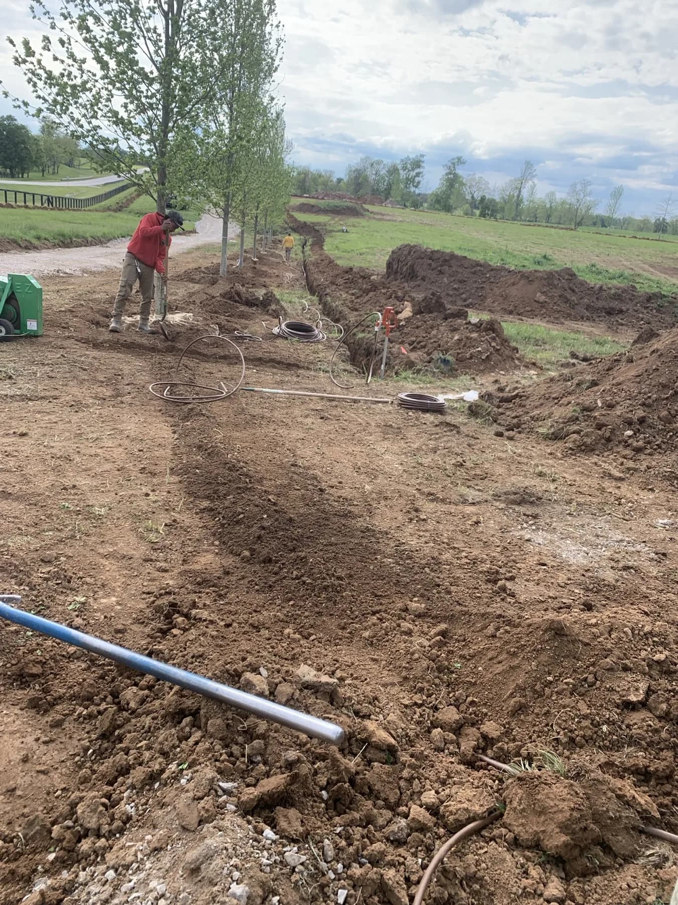 Irrigation line installation for a farm tree planting project in Paris, Kentucky